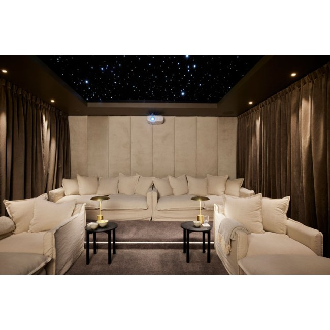 Modern room setting illuminated by the captivating StarEFX™ Acoustic Starlight Panels.